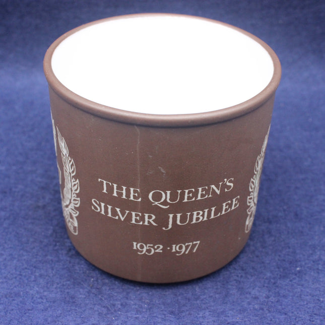 Brown mug with 'The Queen's Silver Jubilee' text on a blue background