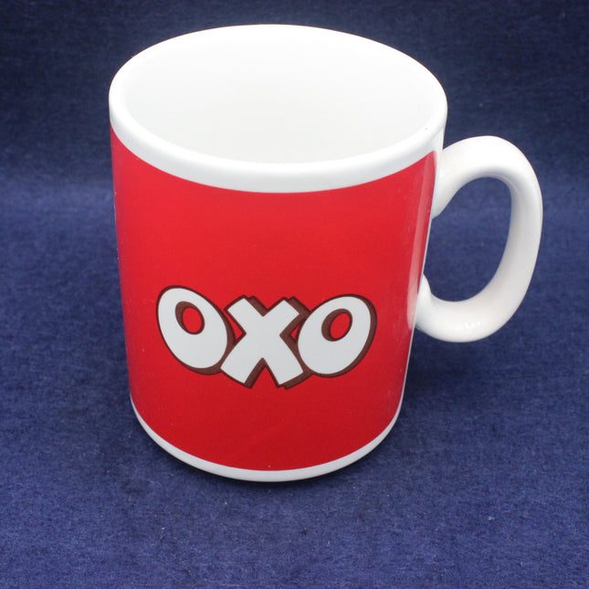 Red mug with 'OXO' logo on a blue background