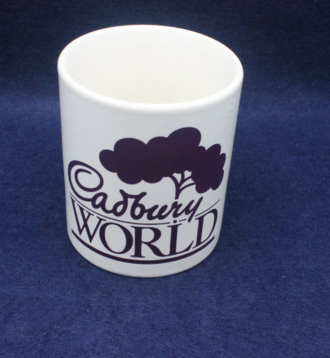 White mug with 'Cadbury World' text on a blue background