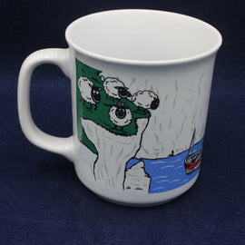 White mug with a cartoon character design on a dark blue background
