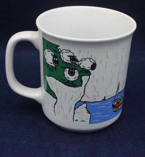 White mug with a cartoon character design on a dark blue background