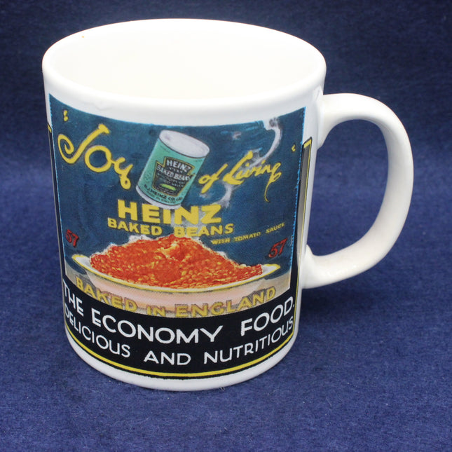 White mug with Heinz baked beans label design on a blue background
