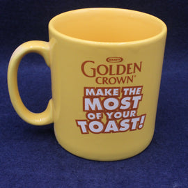 Yellow mug with 'Golden Crown' branding and text on a blue background