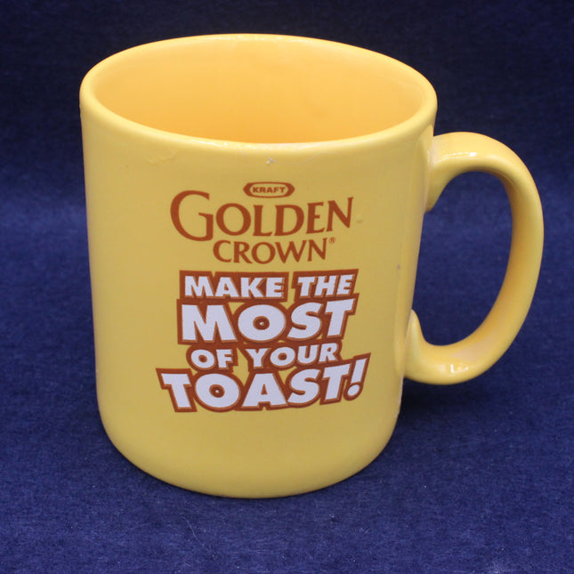 Yellow mug with 'Golden Crown' branding and text on a blue background