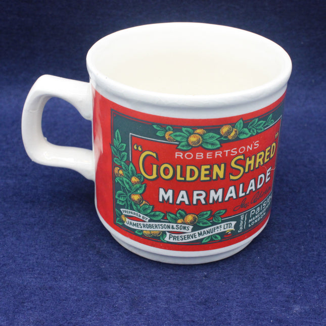 White mug with a red label featuring 'Robertson's Golden Shred Marmalade' on a blue background