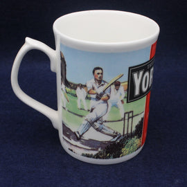 White mug with cricket-themed design and 'Yorkshire Tea' branding on a dark blue background