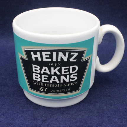 White mug with Heinz Baked Beans label on a blue background