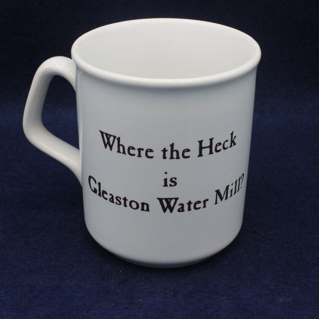 White mug with text 'Where the Heck is Gleaston Water Mill?' on a dark blue background