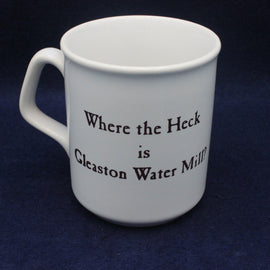 White mug with text 'Where the Heck is Gleaston Water Mill?' on a dark blue background