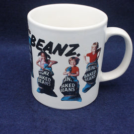 White mug with Heinz baked beans design on a blue background