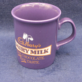 Purple mug with Cadbury's Dairy Milk branding on a blue background