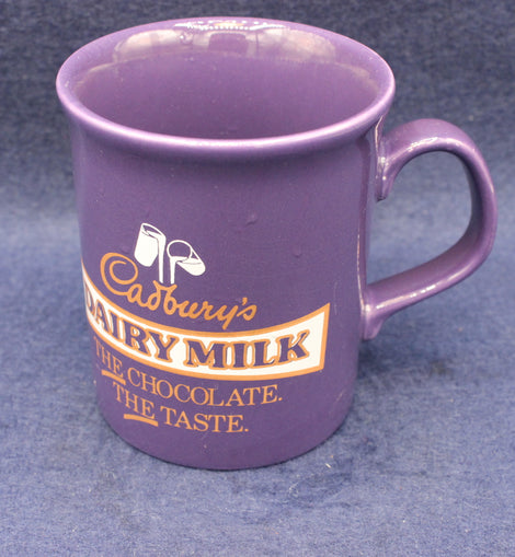 Purple mug with Cadbury's Dairy Milk branding on a blue background