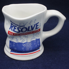 White ceramic mug with 'Resolve' branding on a dark blue background