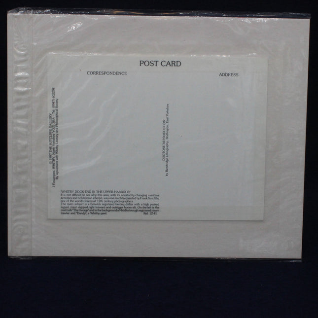 White postcard with text on a black background