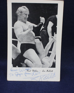 Vintage wrestling photograph owith autograph on a dark background Les Kellet 