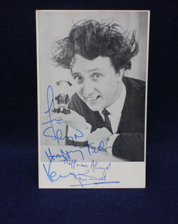 Autographed photo of comedian ken Dodd  with a dark background