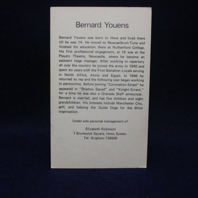 Card with text about Bernard Youens on a dark background