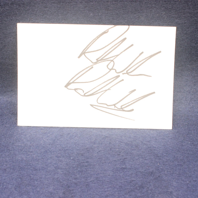 White card with gold abstract design on a gray background