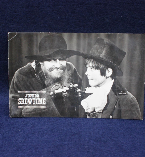 Vintage-style photo of two men in formal attire with 'Junior Showtime' text.