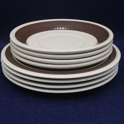 Stack of ceramic plates with a dark background