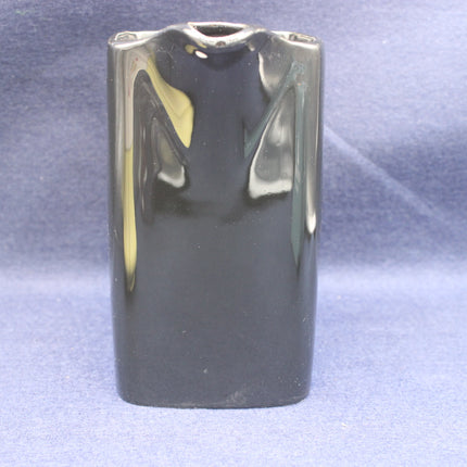 Black jug object on a blue background