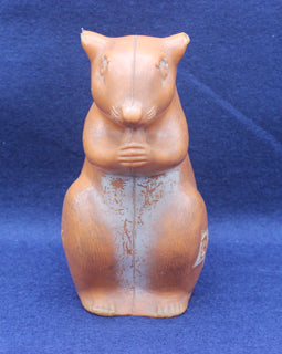 Squirrel moneybox on blue background