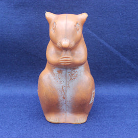 Squirrel moneybox on blue background