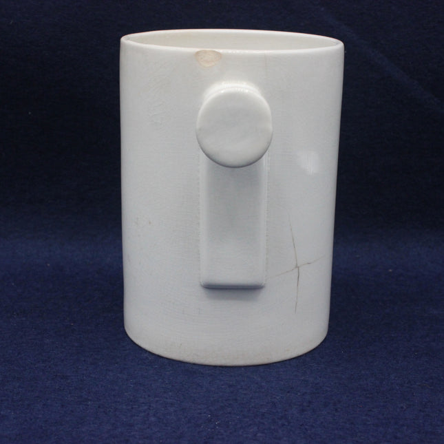 Ceramic mug with a face design on a dark blue background