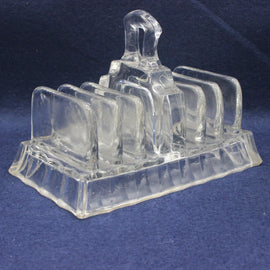 Vintage glass toast rack on a blue background