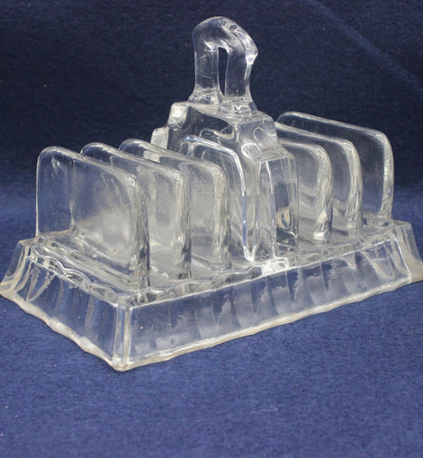 Vintage glass toast rack on a blue background