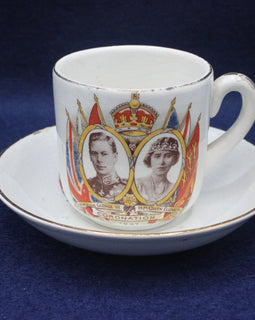Cup and saucer with royal design on a blue background