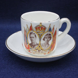 Cup and saucer with royal design on a blue background