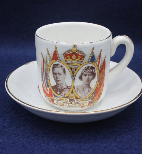 Cup and saucer with royal design on a blue background