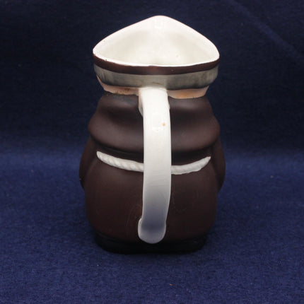Glass mushroom-shaped object on a dark blue background