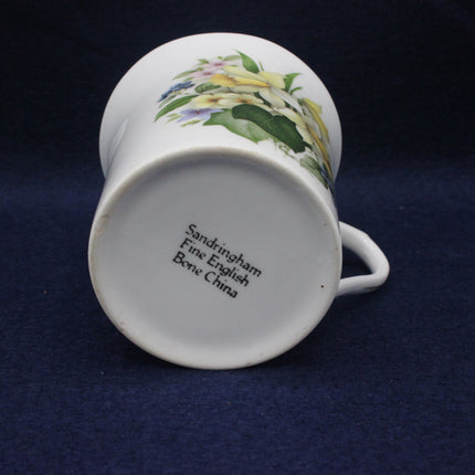 Ceramic mug with floral design on a dark blue background