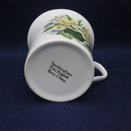 Ceramic mug with floral design on a dark blue background