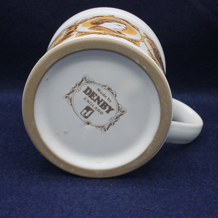 Denby mug with a visible brand logo on a dark blue background