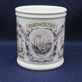 White ceramic mug with decorative purple design and text on a blue background