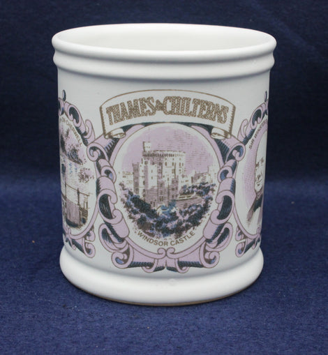 White ceramic mug with decorative purple design and text on a blue background