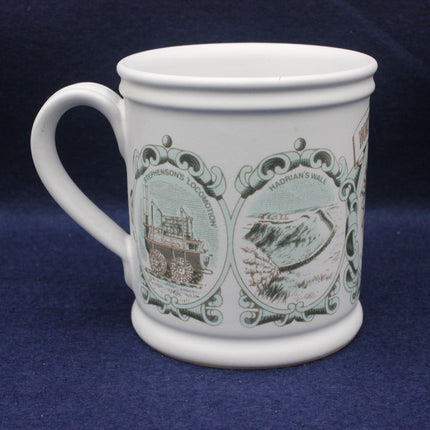 White mug with decorative designs on a blue background