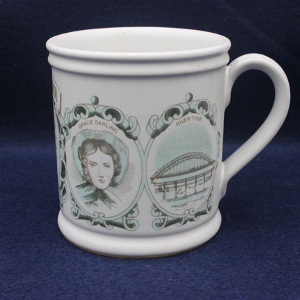White mug with green decorative elements featuring a portrait and architectural design on a blue background