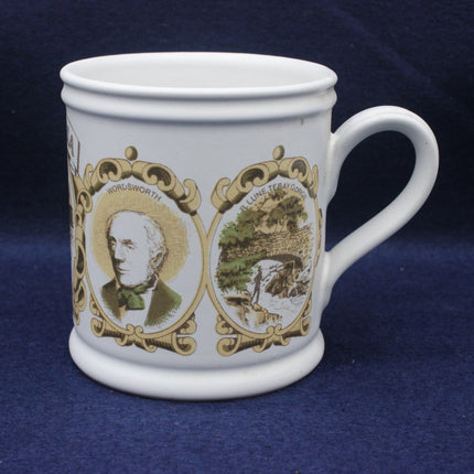 White mug with decorative portraits and landscapes on a blue background