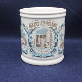 White ceramic mug with 'Heart of England' design on a blue background