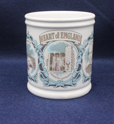 White ceramic mug with 'Heart of England' design on a blue background