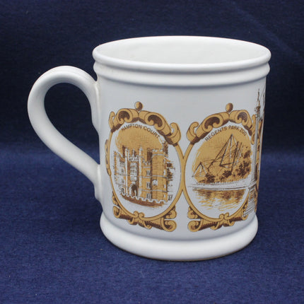 White mug with gold decorative designs on a blue background