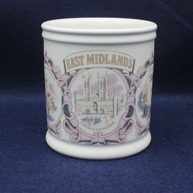 White mug with 'East Midlands' and cathedral design on a blue background