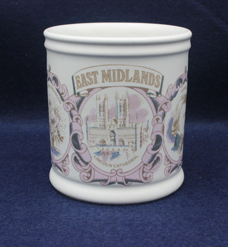 White mug with 'East Midlands' and cathedral design on a blue background