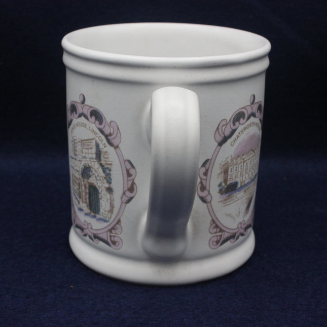 White mug with decorative patterns on a dark blue background