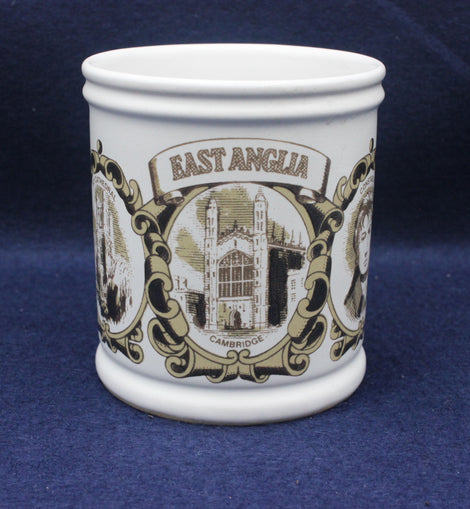 White mug with 'East Anglia' and architectural design on a blue background