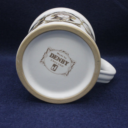 Ceramic mug with 'Made by Denby England' branding on a dark blue background